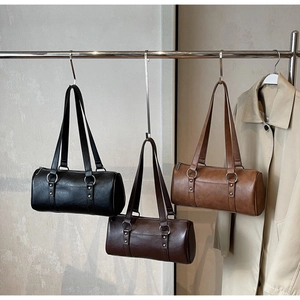 Retro wax leather pillow shoulder bag in black, dark brown and tan colors with metal rings