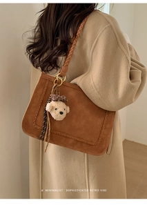 Brown faux suede tote bag with U-shaped woven details and cute plush bear charm