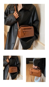 Vue détaillée du sac Boston marron vintage montrant la texture cuir et le noeud