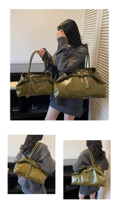 Detail view of large and small olive green pleated leather tote bags with glossy finish
