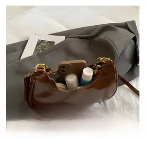Interior view of the brown crescent bag showing large capacity for daily essentials