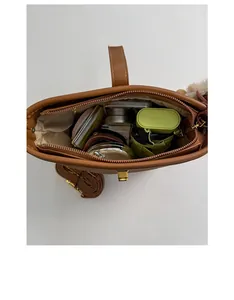 Interior view of brown faux suede bucket bag showing spacious storage for daily items