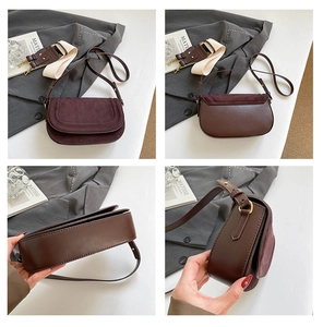 Detail view of brown saddle bag showing matte suede flap and smooth leather texture