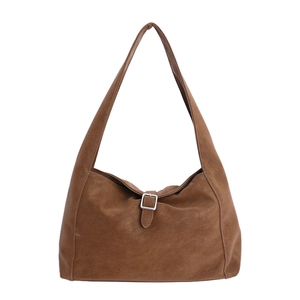 Minimalist brown vintage leather underarm shoulder bag with buckle detail and rounded shape