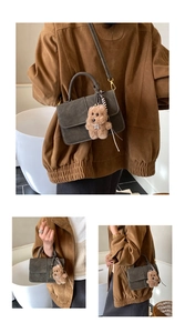 Detail of retro grey crossbody bag with matte leather and cute plush bear charm