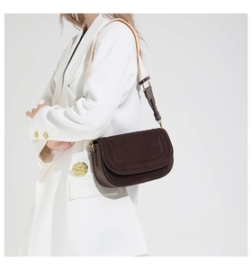 Minimalist coffee brown crossbody bag styled with a white wool coat for a chic look