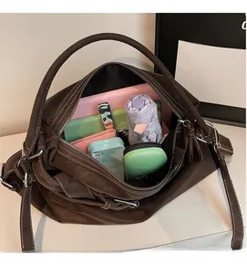 Interior view of spacious dark brown tote bag showing large capacity for personal items