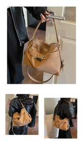 Detail of tan faux leather tote bag showing vintage buckle and smooth metal zipper closure