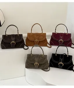 Collection of minimalist suede crossbody bags in five colors with gold hardware