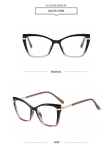 Detail of cat eye glasses frame with black to pink gradient and gold metal accents
