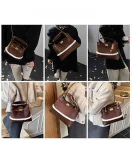 Detail of vintage brown suede chain bag with white faux fur trim and quilted patterns
