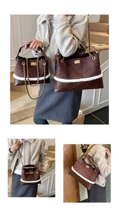 Detail of vintage brown suede handbags in two sizes with diamond lattice and chain straps