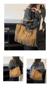 Detail of a brown suede tote bag with layered tassels for a trendy vintage look