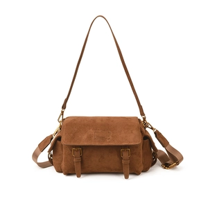Vintage brown suede messenger bag with gold buckles and dual shoulder strap design