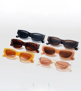 Flat lay of retro cat-eye sunglasses in multiple colors including black and leopard