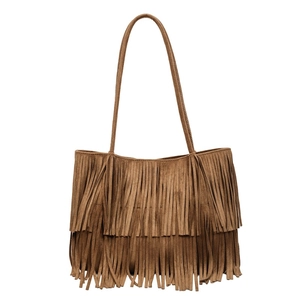 Close-up of bohemian brown suede tote bag featuring double-layered long fringe tassels
