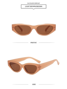 Detail view of light brown cat eye sunglasses with silver studs and brown lenses