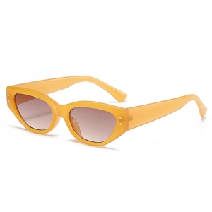 Modern vintage cat eye sunglasses in translucent yellow with brown gradient lenses
