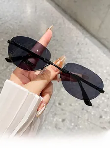 Detail of rimless oval sunglasses with dark gradient lenses and slim black temples