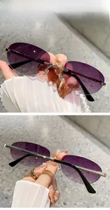 Detail of rimless oval sunglasses with purple gradient lenses and metallic temples