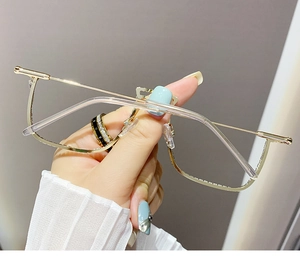 Detailed view of fashionable gold semi-rimless frames with luxury diamond accents for women
