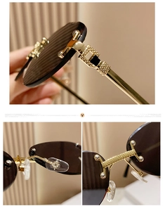Detail of rimless oval sunglasses with gold metal hinges and brown tinted lenses