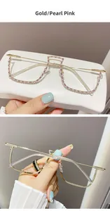 Close-up of gold metal half-frame glasses with pink rhinestone and pearl detailing