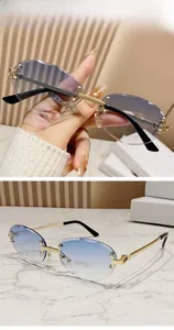 Detail of rimless oval sunglasses with blue gradient lenses and gold textured metal arms