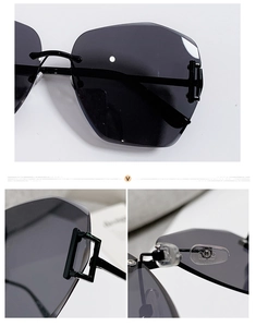Detail view of rimless oversized sunglasses with geometric lenses and metal hinges