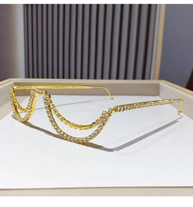 Detailed close-up of a gold metal semi-rimless frame with double-layer rhinestone chains