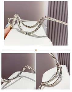 Detail of silver double-layered rhinestone frame with shimmering crystal fringe accents