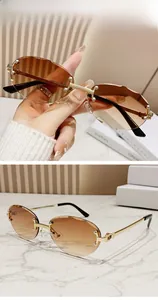 Detail of rimless double brown gradient sunglasses with wavy edges and gold metal temples