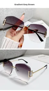 Detail of rimless gradient grey brown oversized sunglasses with gold metal hollow temple