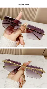 Close-up of golden leopard metal decor on frameless rimless grey gradient sunglasses