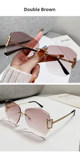 Detail view of rimless oversized sunglasses with brown gradient lenses and gold temples