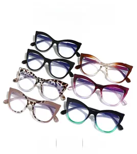 Flat lay of cat-eye glasses frames in multiple colors including tortoiseshell and black