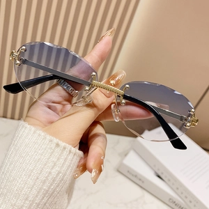 Classic rimless oval sunglasses with gradient purple lenses and gold bridge detail