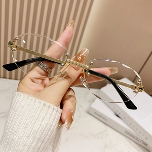 Retro rimless oval sunglasses with diamond cut lenses and gold textured metal frame