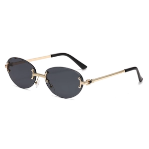 Retro rimless oval sunglasses with gold metal frame and dark grey lenses for fashion wear