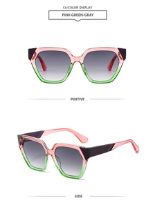 Detail view of pink and green geometric hexagonal sunglasses with gradient grey lenses