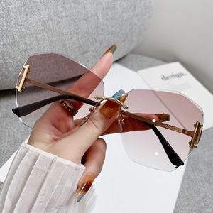 Fashionable rimless gradient oversized sunglasses with irregular cut-edge lenses and gold frame