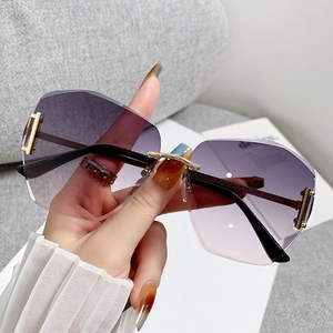 Chic oversized rimless sunglasses with purple gradient lenses and gold metal accents