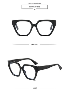 Detail view of large geometric black and white frames showing front and side angles