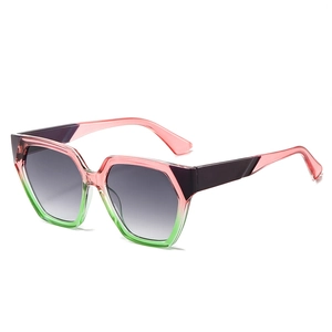 Fashionable oversized pentagon sunglasses with pink-green gradient frames and grey lenses