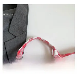 Detailed view of reinforced checkered PVC tote handles with professional stitching