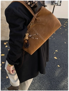 Brown suede tote bag for women, stylish minimalist shoulder bag for daily commute and fashion.