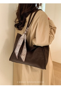 Deep coffee retro tote bag with paisley silk scarf accessory shown on model
