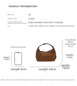 Size comparison of dark brown suede tote bag next to a smartphone for scale