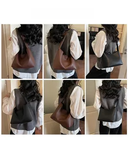 Detailed views of vintage pebbled leather hobo bag showing shoulder and crossbody wear