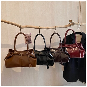 Row of retro glossy oil wax leather tote bags in brown, black, coffee and burgundy colors